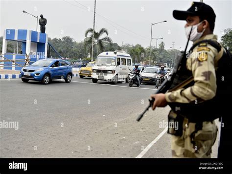 A Kolkata police commando holds a gun as a part of preparation of ...