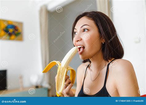 Eating Banana in Her Apartment Stock Image - Image of house, female: 174041305