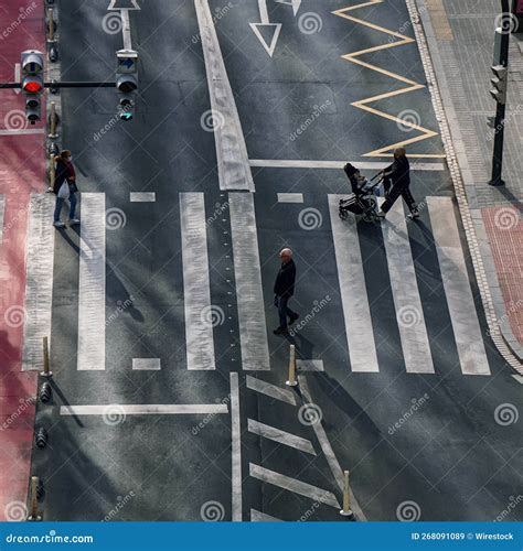 High Angle Shot Of Pedestrians Crossing The Crosswalk In The City