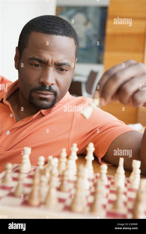 African American man playing chess Stock Photo - Alamy