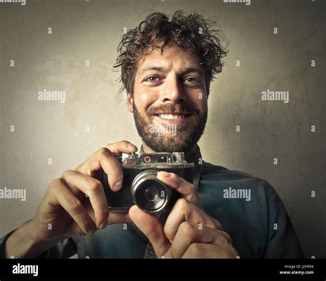 Man holding vintage camera Stock Photo - Alamy