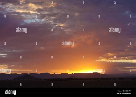 sunrise over hills Stock Photo - Alamy