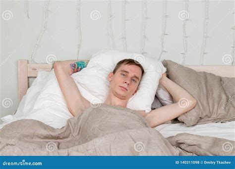 Handsome Young Adult Man Sleeping In Bed Guy Is Resting Stock Photo