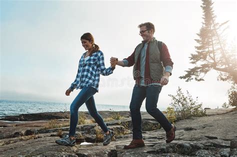 Watch Your Step Babe A Happy Couple Out Hiking Hand In Hand Stock