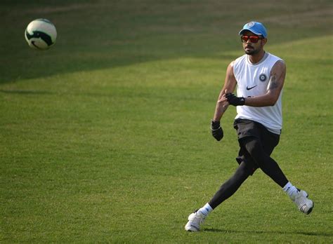 Virat Kohli kicks about a football during a practice session | ESPNcricinfo.com