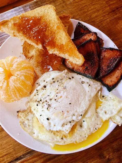 I made fried bologna, mandarin orange, fried eggs, and toast with jam ...