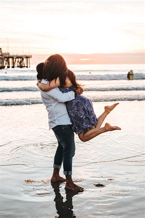 Download Couple Hugging Catcher Hug On Beach At Sunset Wallpaper