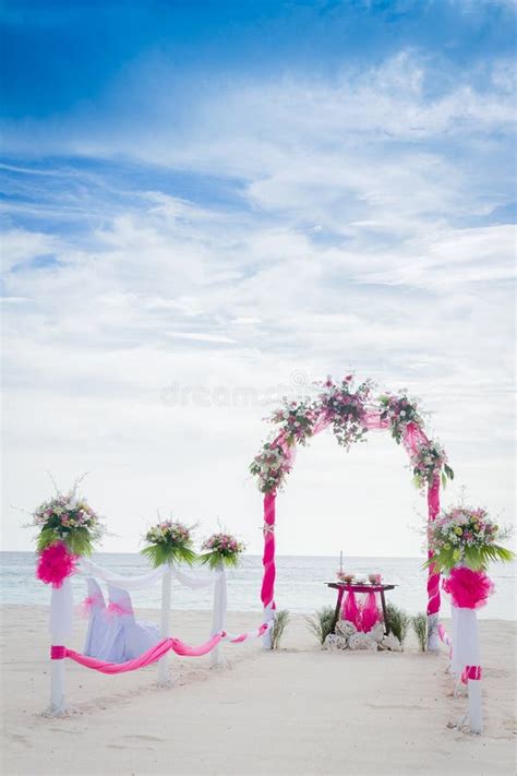 Wedding Arch Decorated With Flowers On Tropical Beach Outd Stock Image