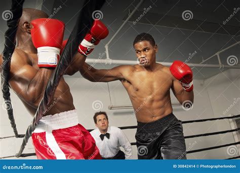 Referee Watching Boxers Fight In The Ring Stock Images Image 30842414