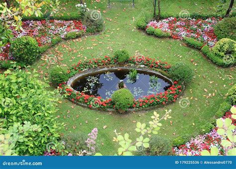 Garden with Flowers and Fountain Stock Photo - Image of natural, floral: 179225536