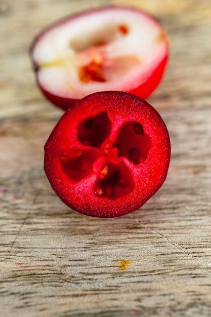 Premium Photo Cut Into Half Ripe Red Berries Of Garden Cranberries