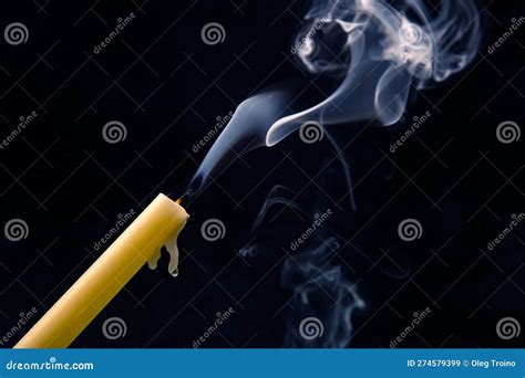 Smoke From An Extinguished Candle On A Dark Background The Concept Of