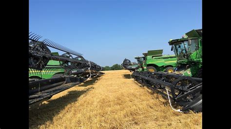 8 John Deere S690 Combines Harvesting Wheat YouTube