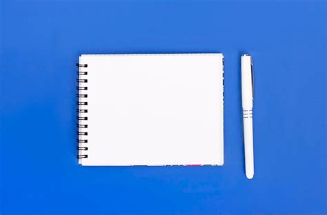 Premium Photo Top View Of Blank Spiral Notepad With Pen Isolated On