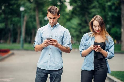 Phone Addicted People Couple In Summer Park Stock Image Image Of