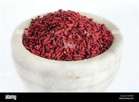 Red Yeast Fermented Rice On White Background Stock Photo Alamy