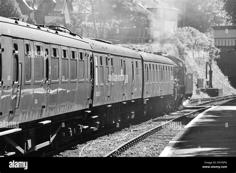 A steam passenger train waiting at a station in the UK Stock Photo - Alamy