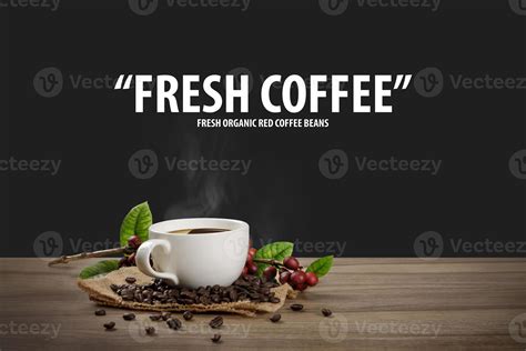 Hot coffee cup with fresh organic red coffee beans and coffee roasts on