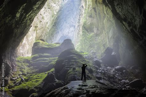 Mystery misty cave entrance in Son Doong Cave, the largest cave in the world in UNESCO World ...