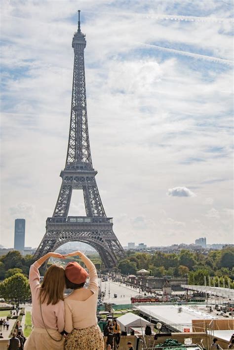 Photo Of Two Women Posing In Front Of Eiffel Tower Paris France