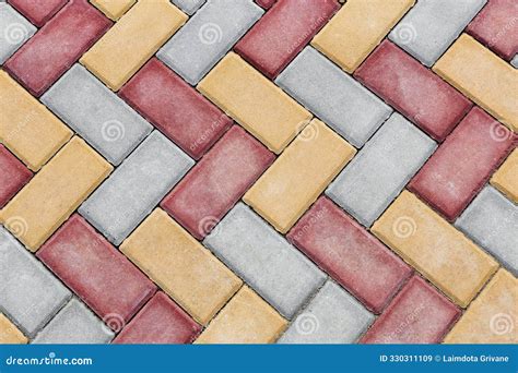 Red And Yellow Brick Paving Stones On A Sidewalk Or Pavement Top View