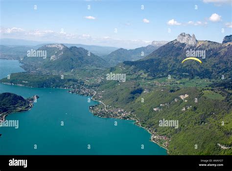 Aerial View Of Lac De Annecy Beautiful Lake With Paraglider Pilot