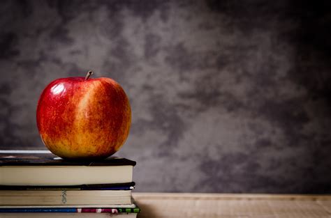 Red And Yellow Apple On Books Hd Wallpaper Wallpaper Flare