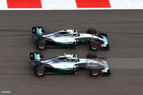 Lewis Hamilton of Great Britain and Mercedes GP and Nico Rosberg of ...