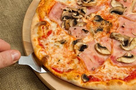 Premium Photo Pizza With Ham And Mushrooms