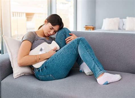Stomach Pain Stress Or Girl On Sofa With Hot Water Bottle For Pms Gas Constipation Or Period