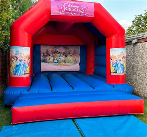 15ft X 12ft Blue And Red Castle Disney Princess New Theme A Wibbly Wobbly Castle Hire