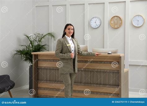 Portrait Of Beautiful Receptionist Near Counter In Hotel Stock Image