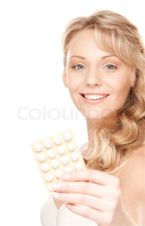 Bild der jungen Frau mit Pillen over white | Stock Bild | Colourbox