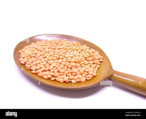 Red Lentils Or Masoor Dal In A Spoon Isolated On White Background Red