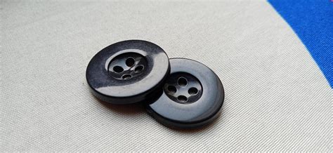 two big black buttons, for clothes 11991607 Stock Photo at Vecteezy