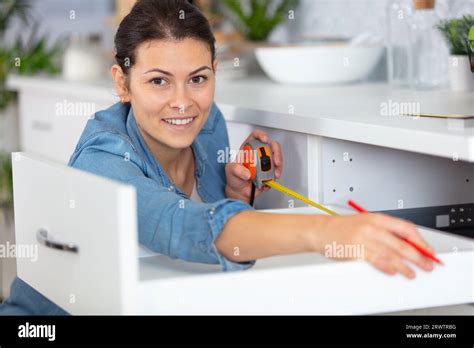 Beautiful Brunette Woman Building Kitchen Stock Photo Alamy