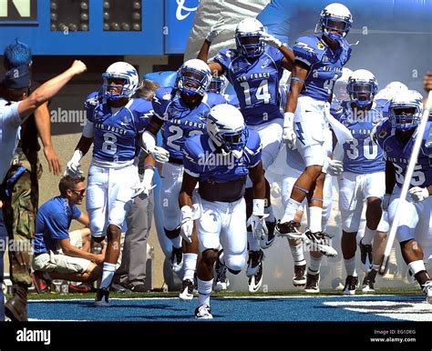 Air Force Academy football players take the field at Falcon Stadium on ...