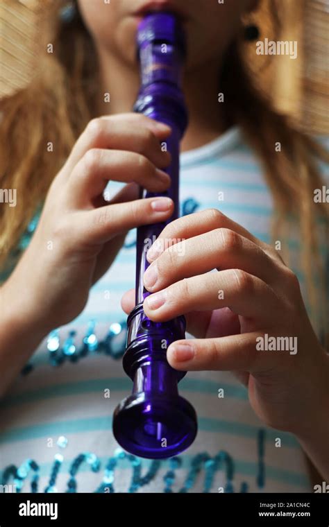 A child playing the recorder Stock Photo - Alamy