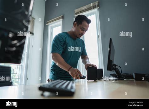 Portrait Of Asian Young Man Fix A Problem Of Personal Computer In