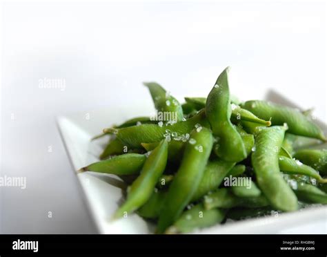 Dish Of Fresh Japanese Edamame Soybeans With Salt Stock Photo Alamy