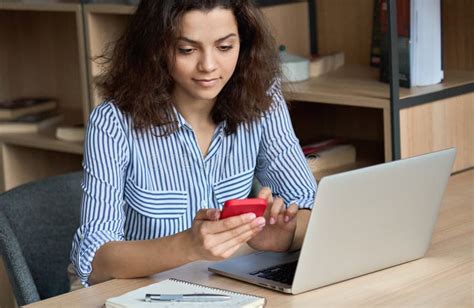 indian student studying smart phone stock   royalty