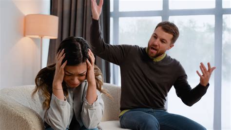 Upset Wife Sit On Couch Crying Listening To Furious Husband Yelling Unhappy Couple Have Fight