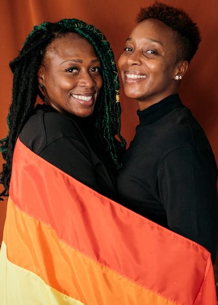 Premium Photo Happy Lesbian Couple With A Colorful Flag