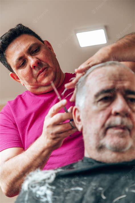 Premium Photo Old Man Getting A Haircut