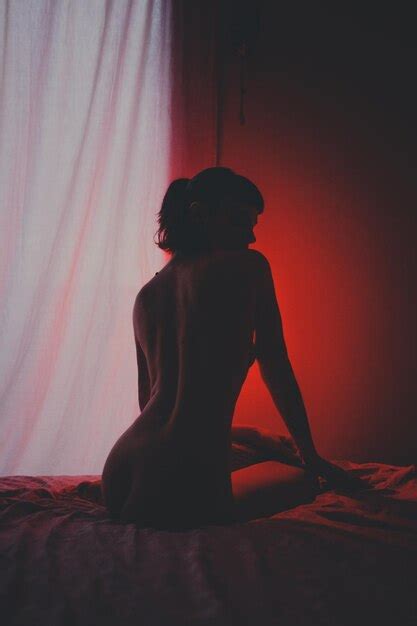 Premium Photo Rear View Of Naked Woman Sitting On Bed At Home