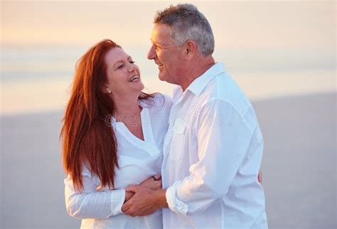 Love Makes Life Even Better Mature People Enjoying The Sunset On The Beach Stock Photo Image