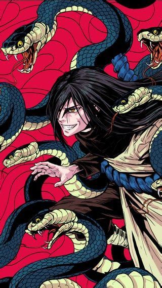 A Woman With Long Black Hair Holding A Snake In Front Of Her Face And