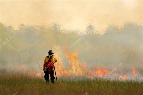 Fireman With Flame In Nature — Stock Photo © Ondrejprosicky 131397106