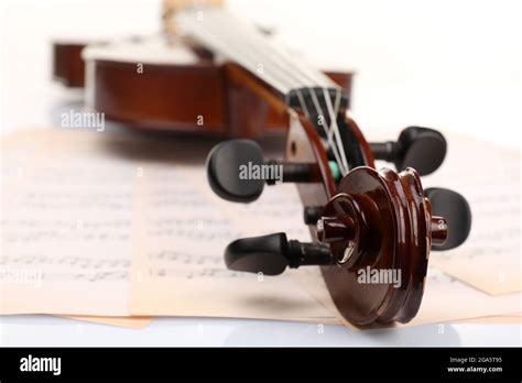 Classical violin on music sheets background Stock Photo - Alamy