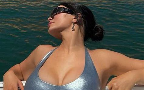 Kylie Jenner Catches Some Sun In Tight Silver One Piece Swimsuit Photo Drop